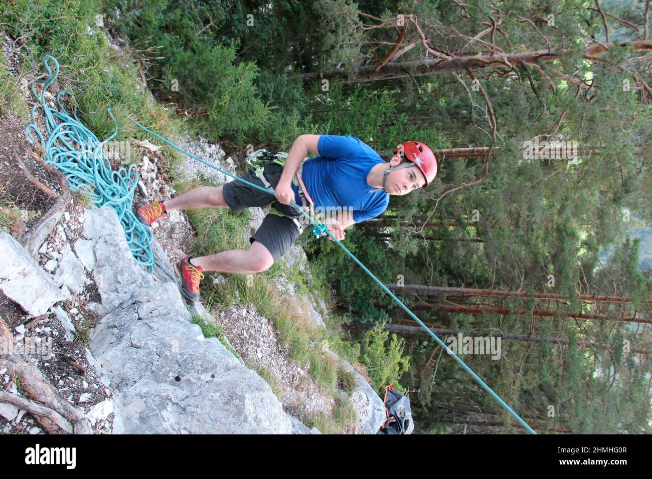 young man secures his colleague while climbing in the climbing garden 'Sonnenplatten Scharnitz' Karwendelgebirge, Scharnitz, Tirol, Austria Stock Photo