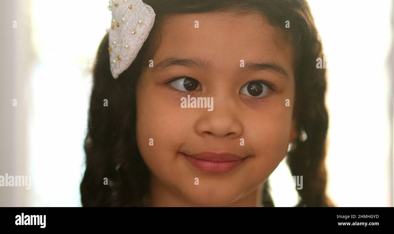 Funny little girl doing crossed eyes Stock Photo Alamy