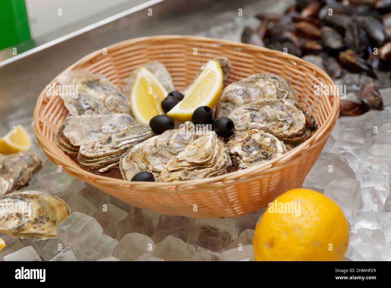 Oysters on ice in a fish shop or restaurant Stock Photo