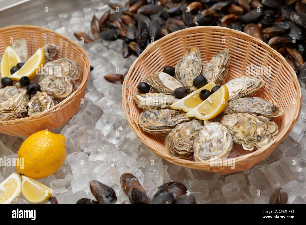 Oysters on ice stall in a fish shop Stock Photo