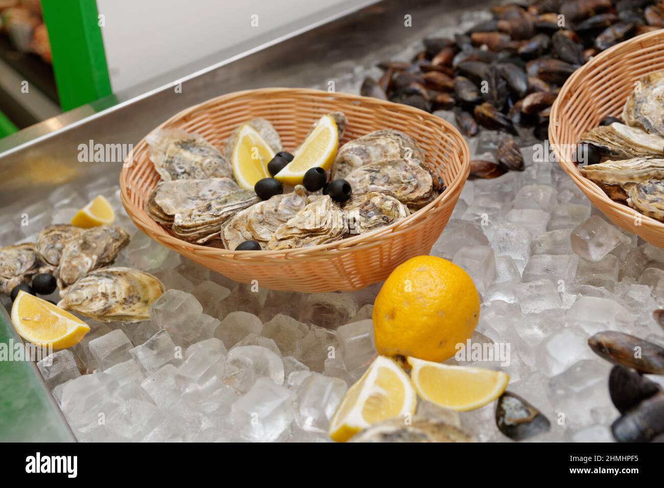 Oysters on ice in a fish shop or restaurant Stock Photo