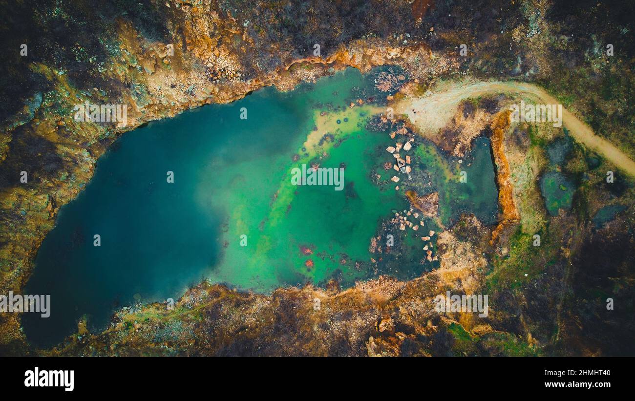 Abandoned limestone quarry with formed lake Stock Photo