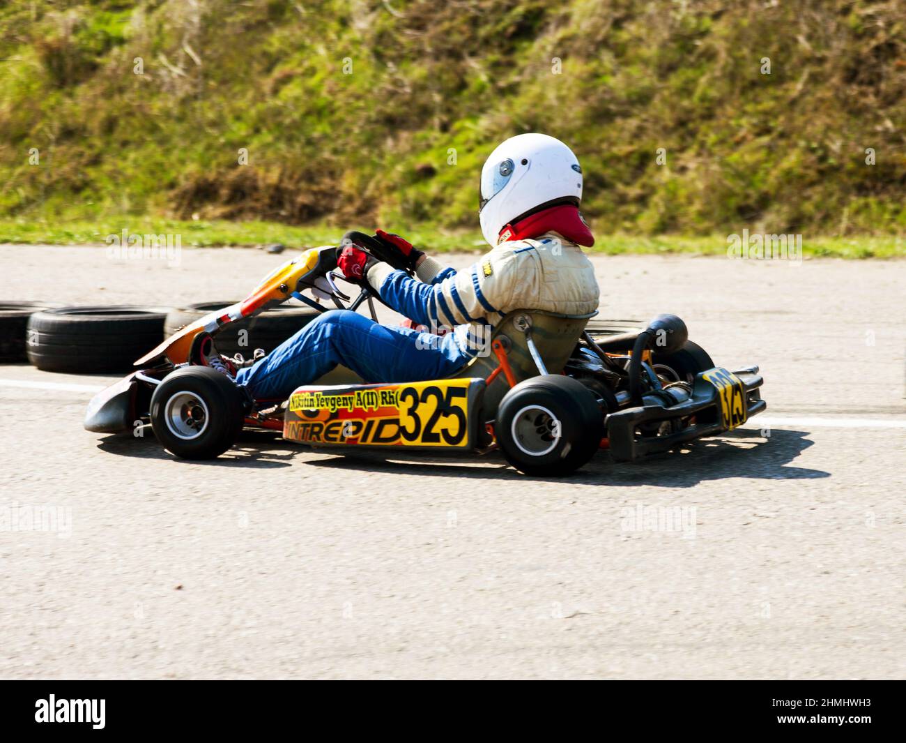 ODESSA, UKRAINE - APRIL 2, 2017: Competitions on the picture, pilots in helmet and in racing clothes participate in the card race. Carting show. Child Stock Photo