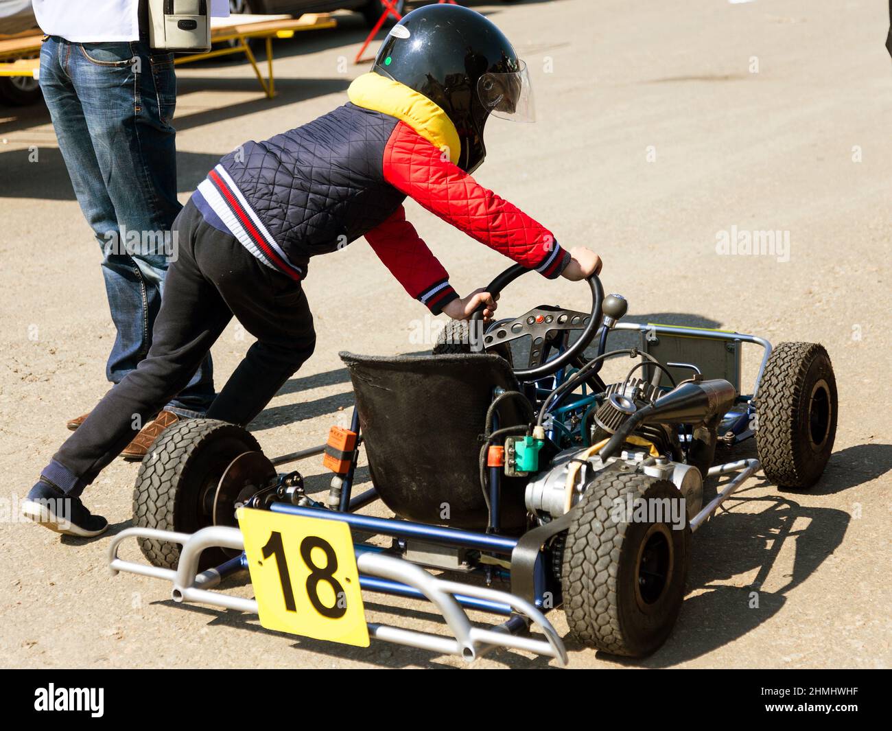 ODESSA, UKRAINE - APRIL 2, 2017: Competitions on the picture, pilots in helmet and in racing clothes participate in the card race. Carting show. Child Stock Photo