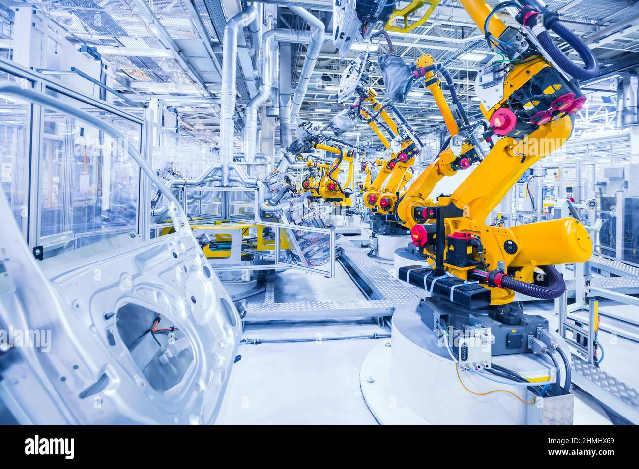 robotic arms in a car plant Stock Photo