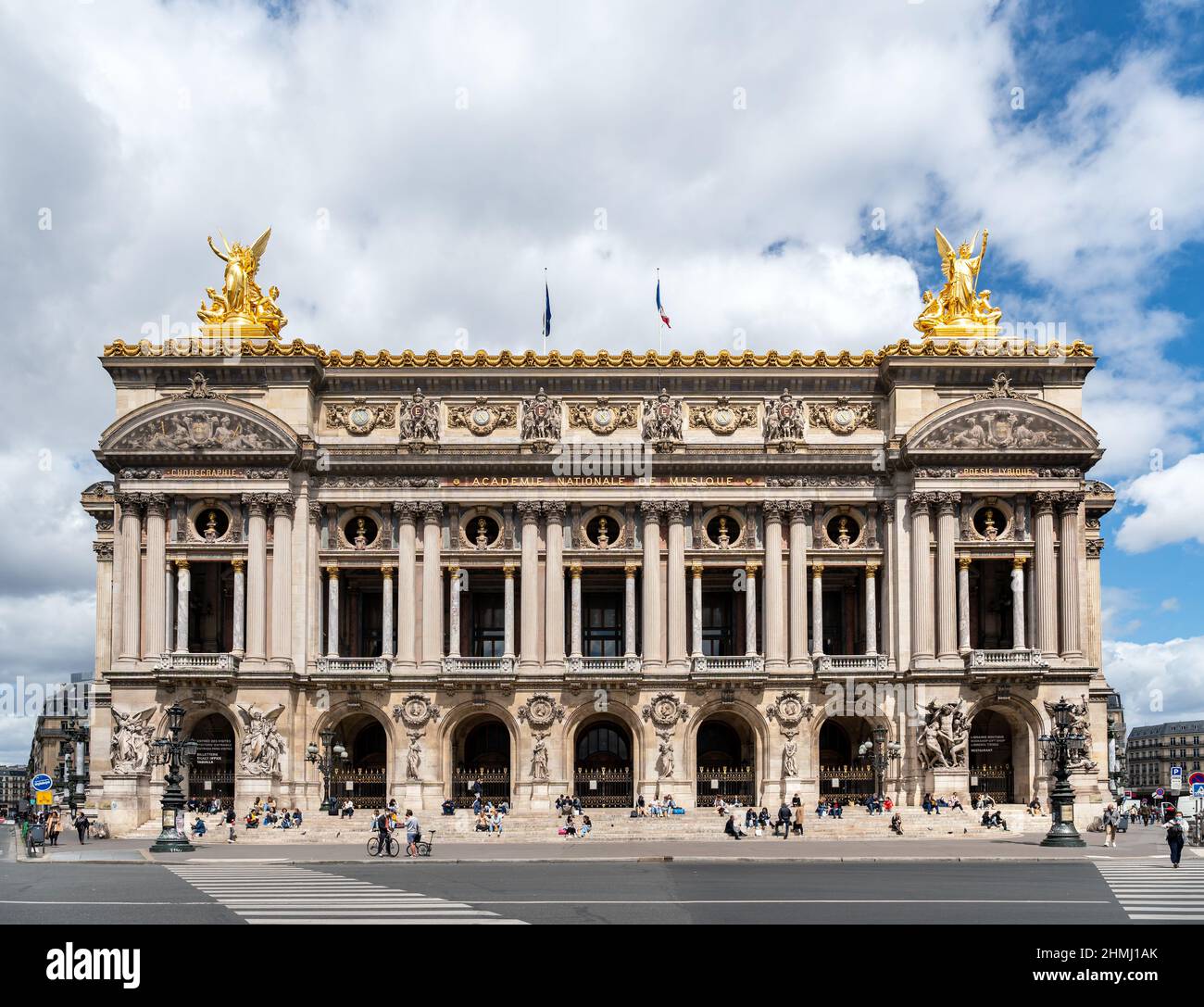 Parisians relaxing on the steps of the Opera Garnier house - Paris, France Stock Photo