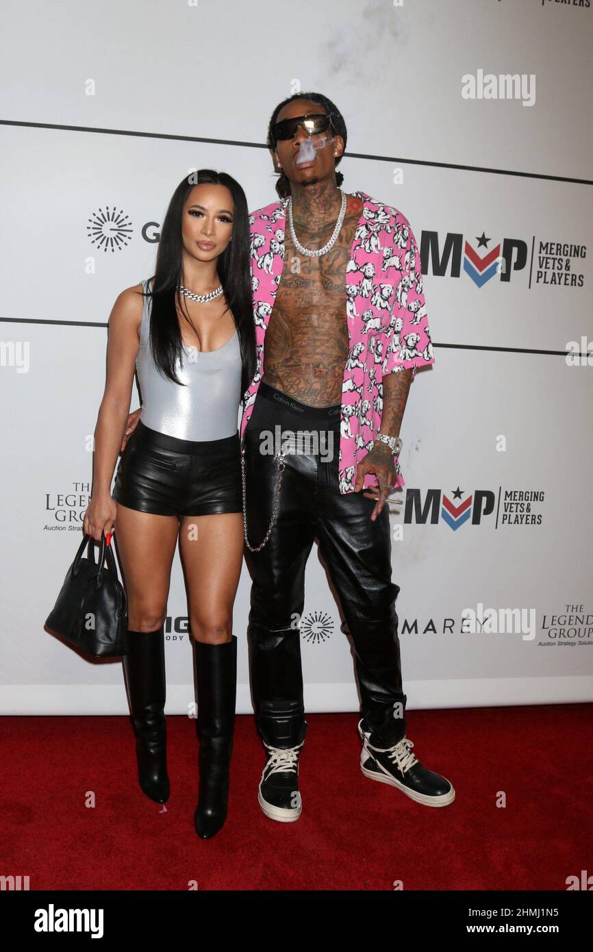 Los Angeles, CA. 9th Feb, 2022. Aimee Aguilar, Wiz Khalifa at arrivals for Merging Vets and Players (MVP) Charity Super Bowl Kick-Off Benefit Fundraiser, Academy LA Nightclub, Los Angeles, CA February 9, 2022. Credit: Priscilla Grant/Everett Collection/Alamy Live News Stock Photo