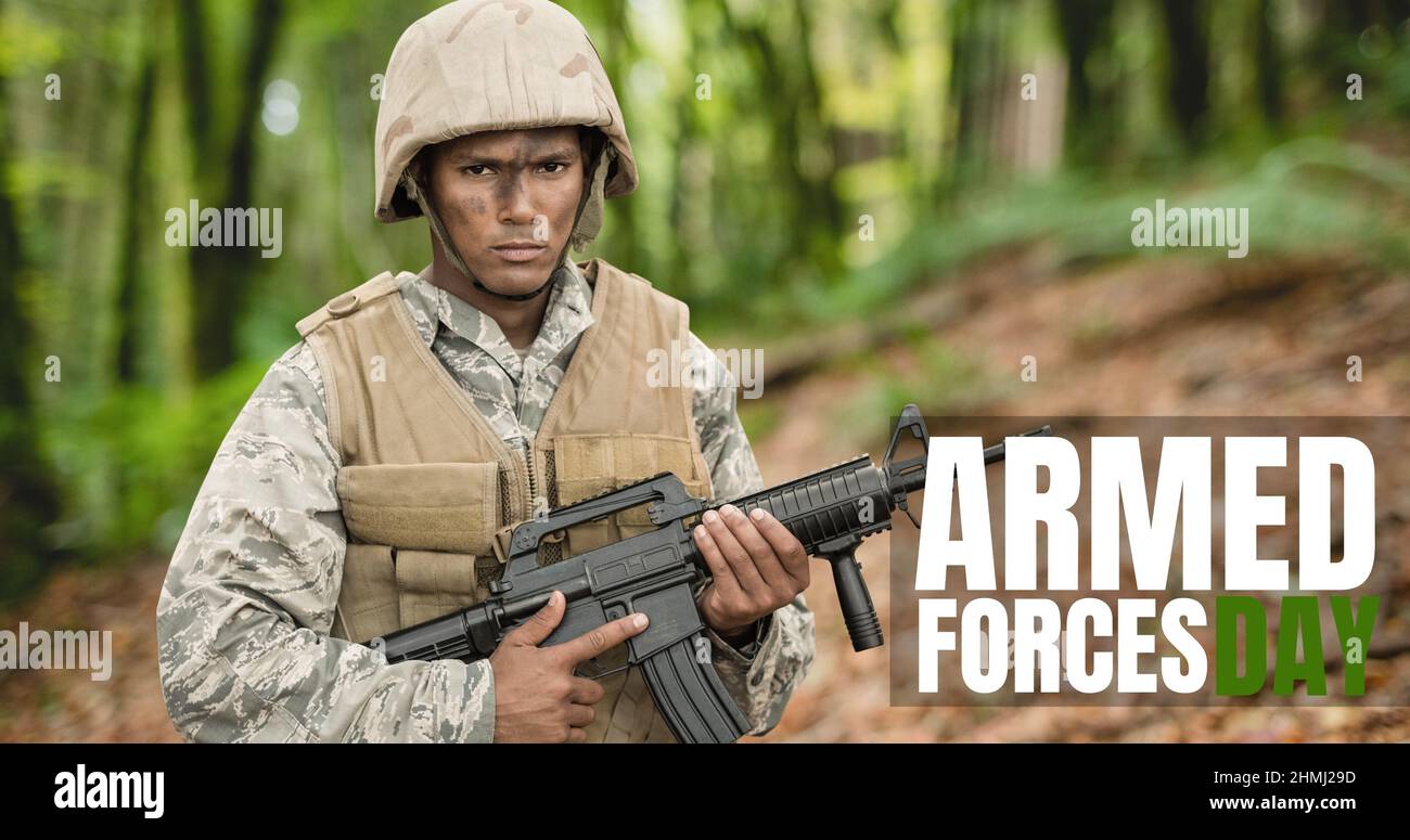 Digital composite image of text over biracial young male soldier standing with rifle Stock Photo