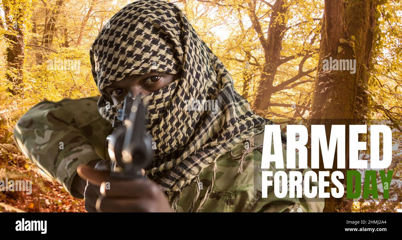 Digital composite image of text over african american young male soldier aiming rifle Stock Photo