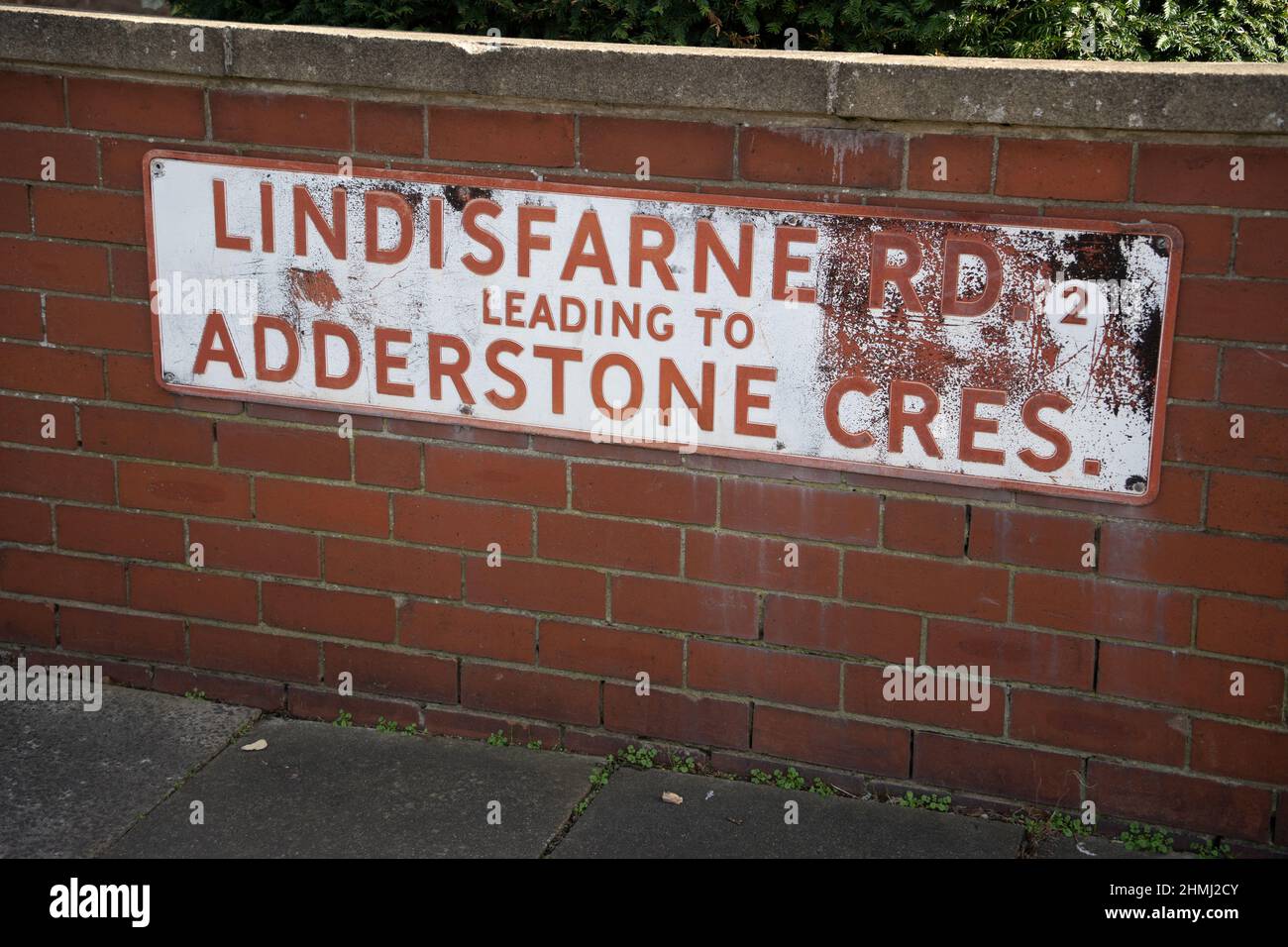 Lindisfarne Road leading to Adderstone Crescent street sign, Jesmond, Newcastle upon Tyne, UK. A desirable area. Stock Photo