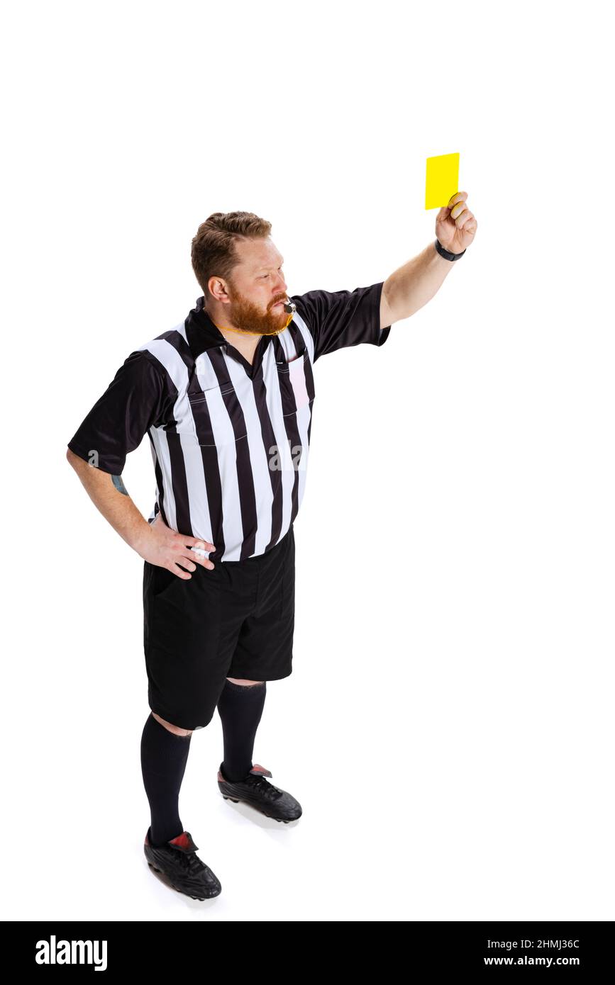 Warning. Dynamic portrait of soccer or football referee running with