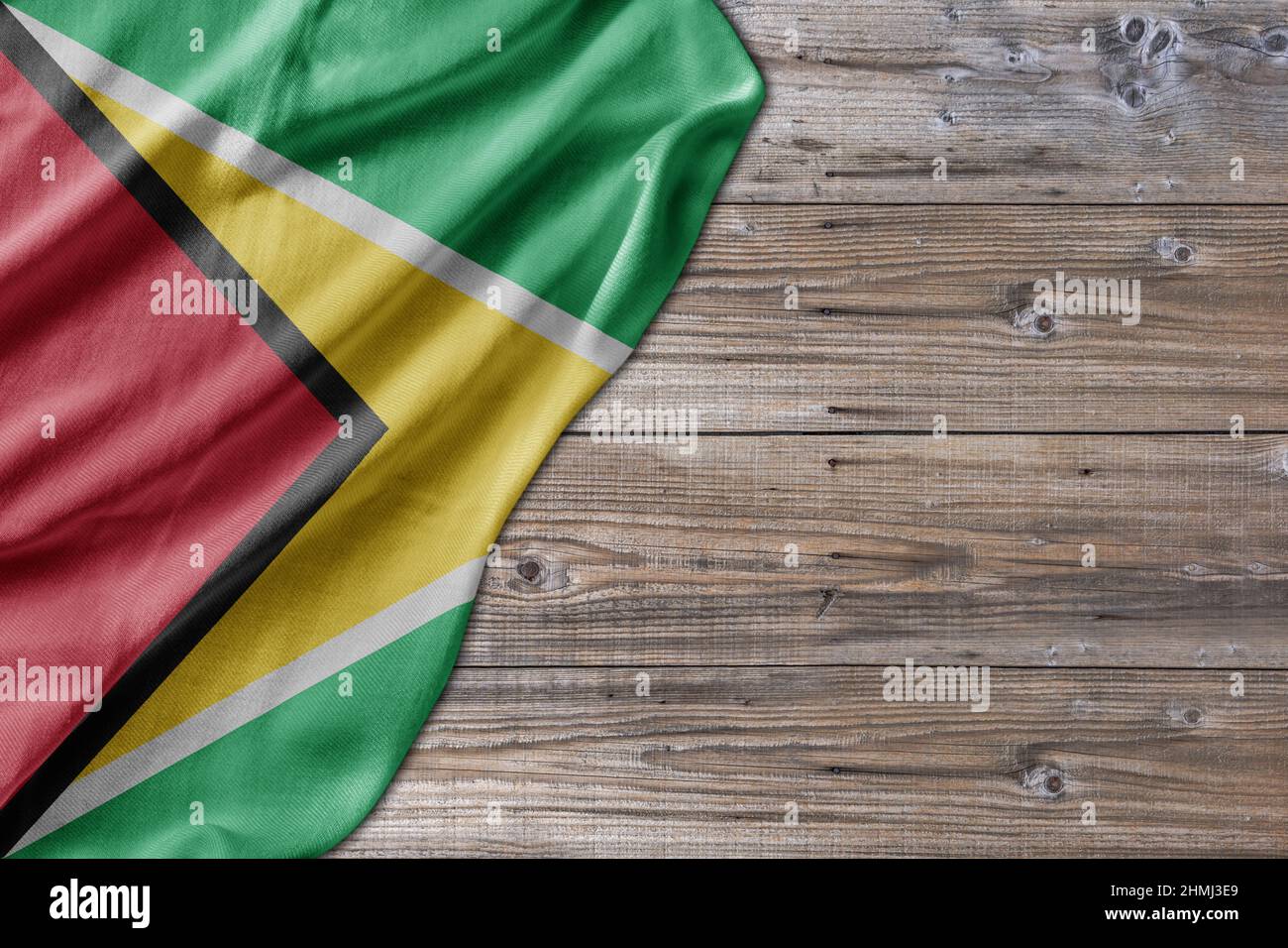 Wooden pattern old nature table board with Guyana flag Stock Photo - Alamy