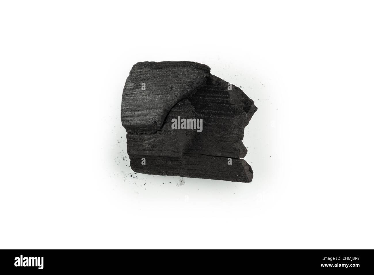 Black oak coal isolated on a white background. Stock Photo