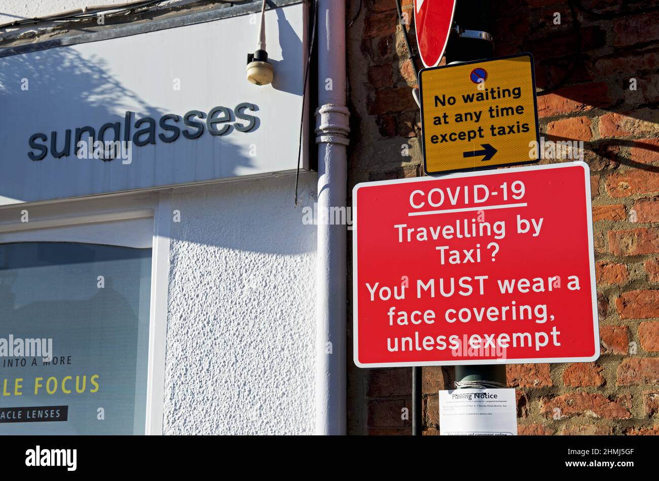 Notice requesting taxi passengers to wear a face mask during the covid pandemic, England UK Stock Photo
