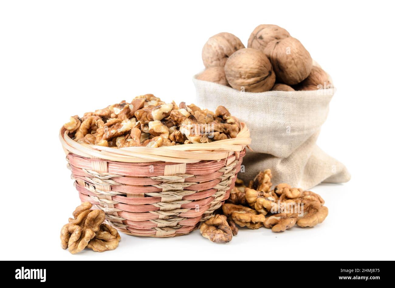 walnuts and kernels in a bag on a white background with soft shadow Stock Photo