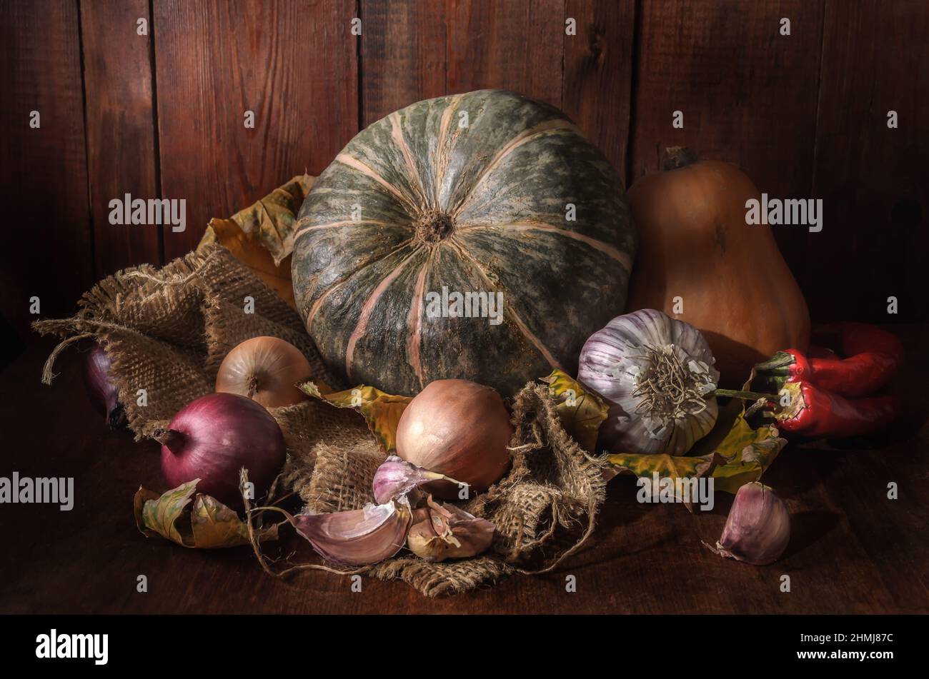 Pumpkin and other vegetables on dark wooden background Stock Photo