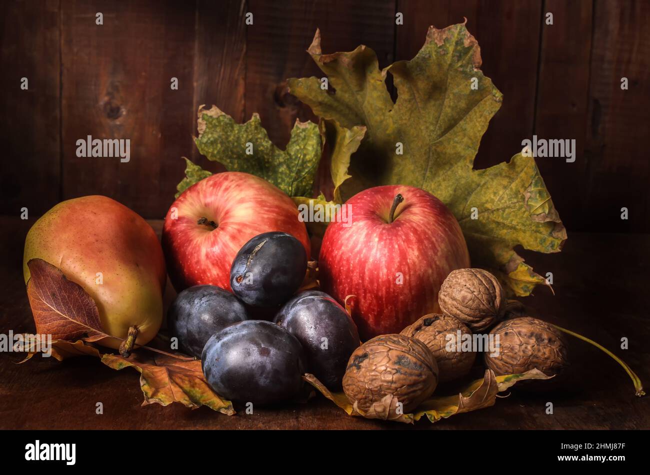 fruits in bulk on a dark wooden background in a rustic style Stock Photo