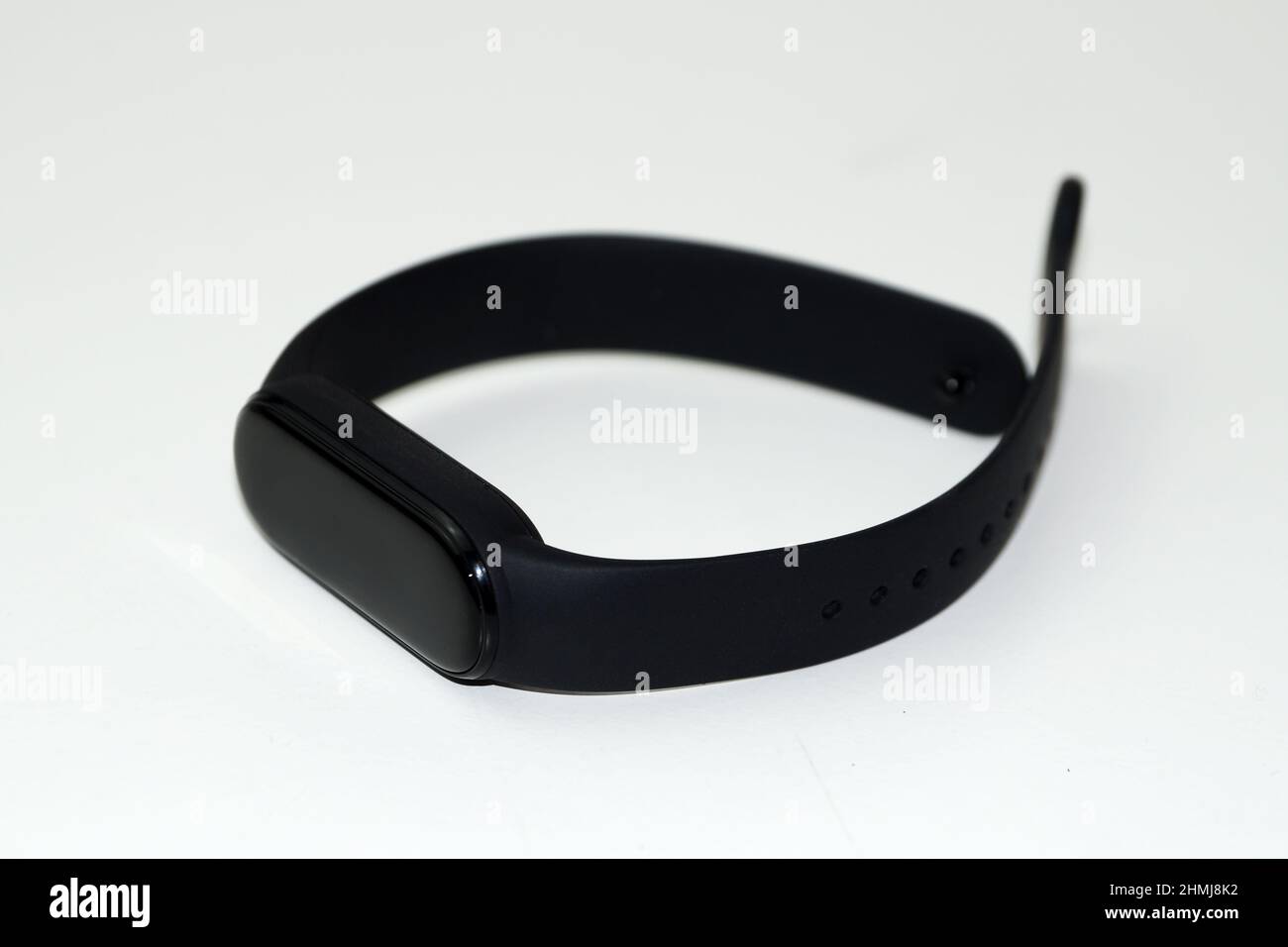 black fitness bracelet on a white background close-up. Stock Photo