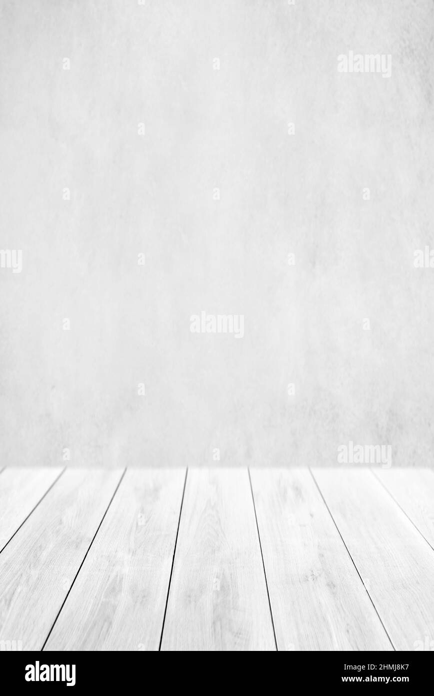 Empty white wood table top and blur wall. Wall Texture Background. Building banner mock up abstract background - can used for display or montage your Stock Photo