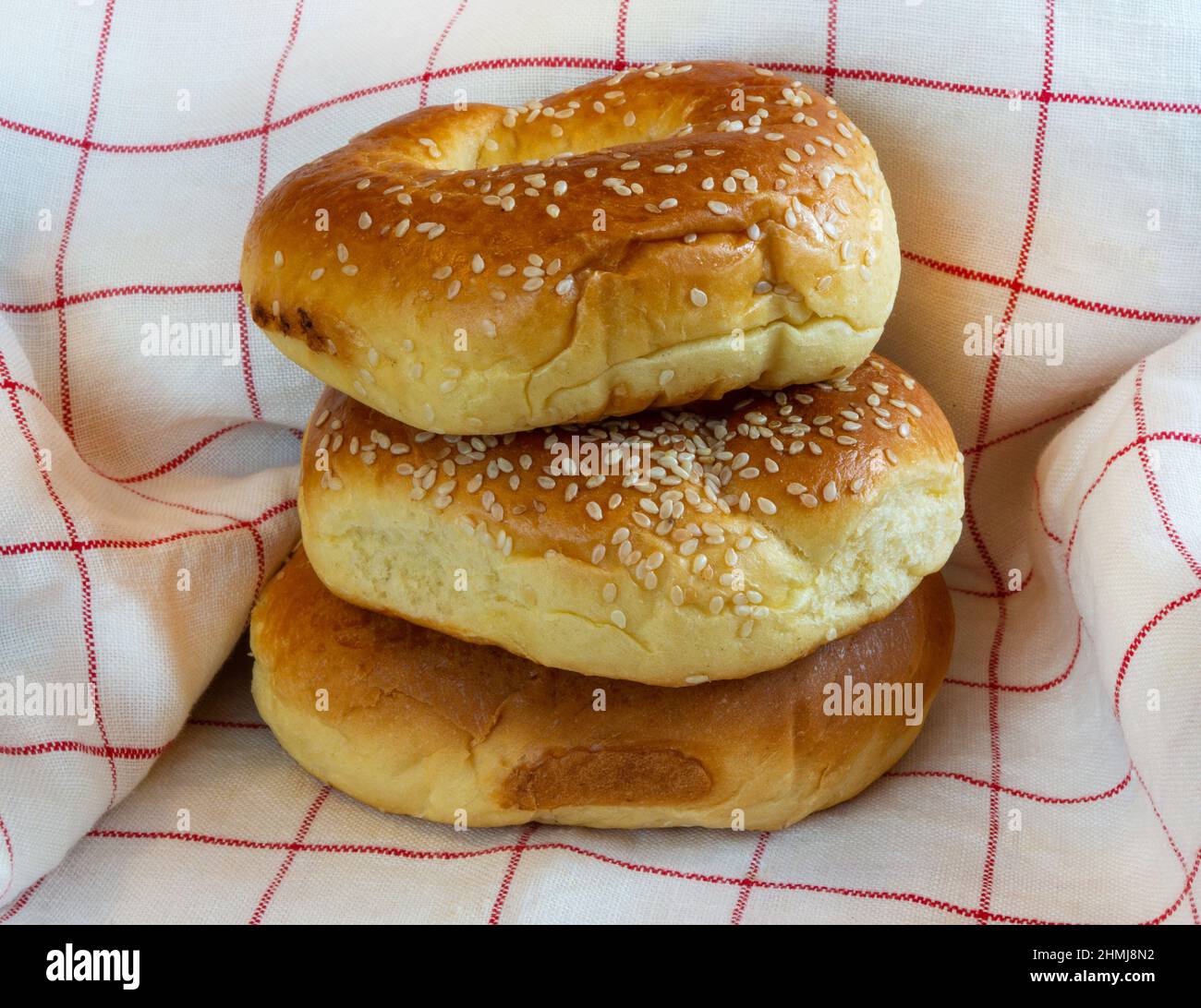 Sesame rolls on kitchen towel background Stock Photo