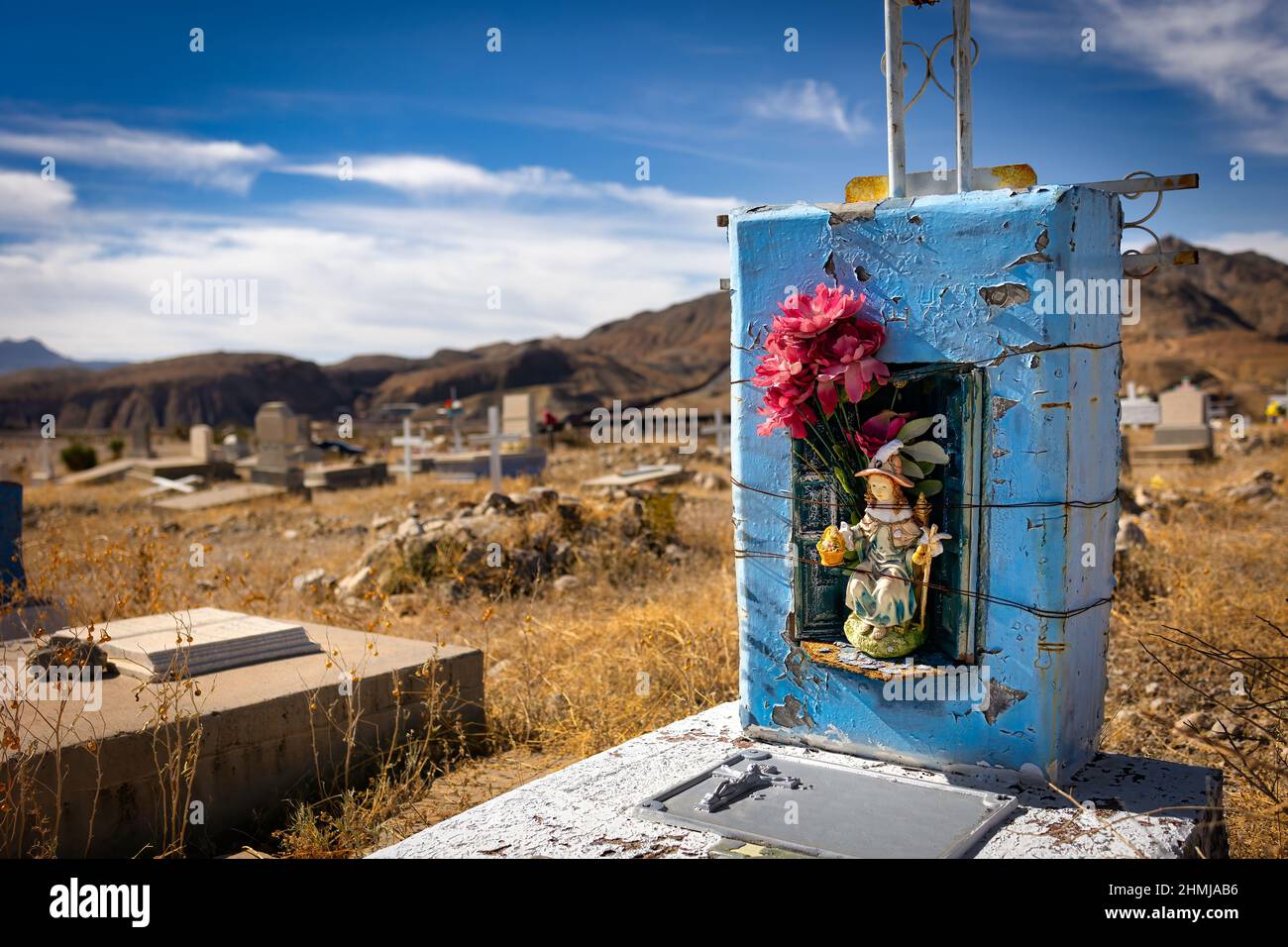 Plastic flowers placed on a grave at the historic Smeltertown Cemetery
