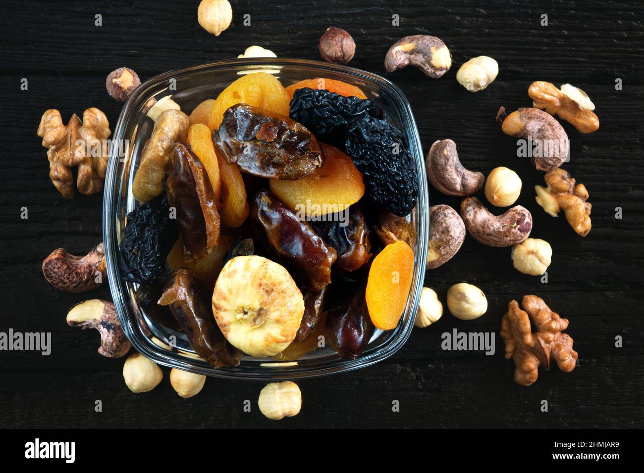 Dried fruits and nuts on old wooden table Stock Photo