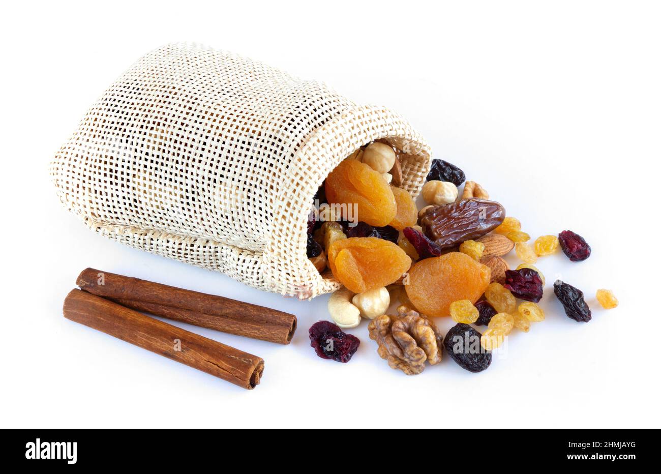 Dried fruits and nuts in a sack on white background Stock Photo