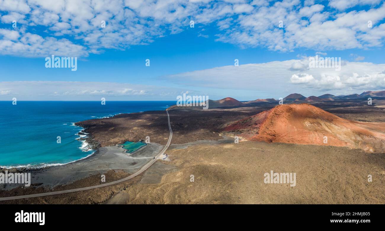 Charco Verde lake and volcan Bermeja on the island of Lanzarote, Spain Stock Photo