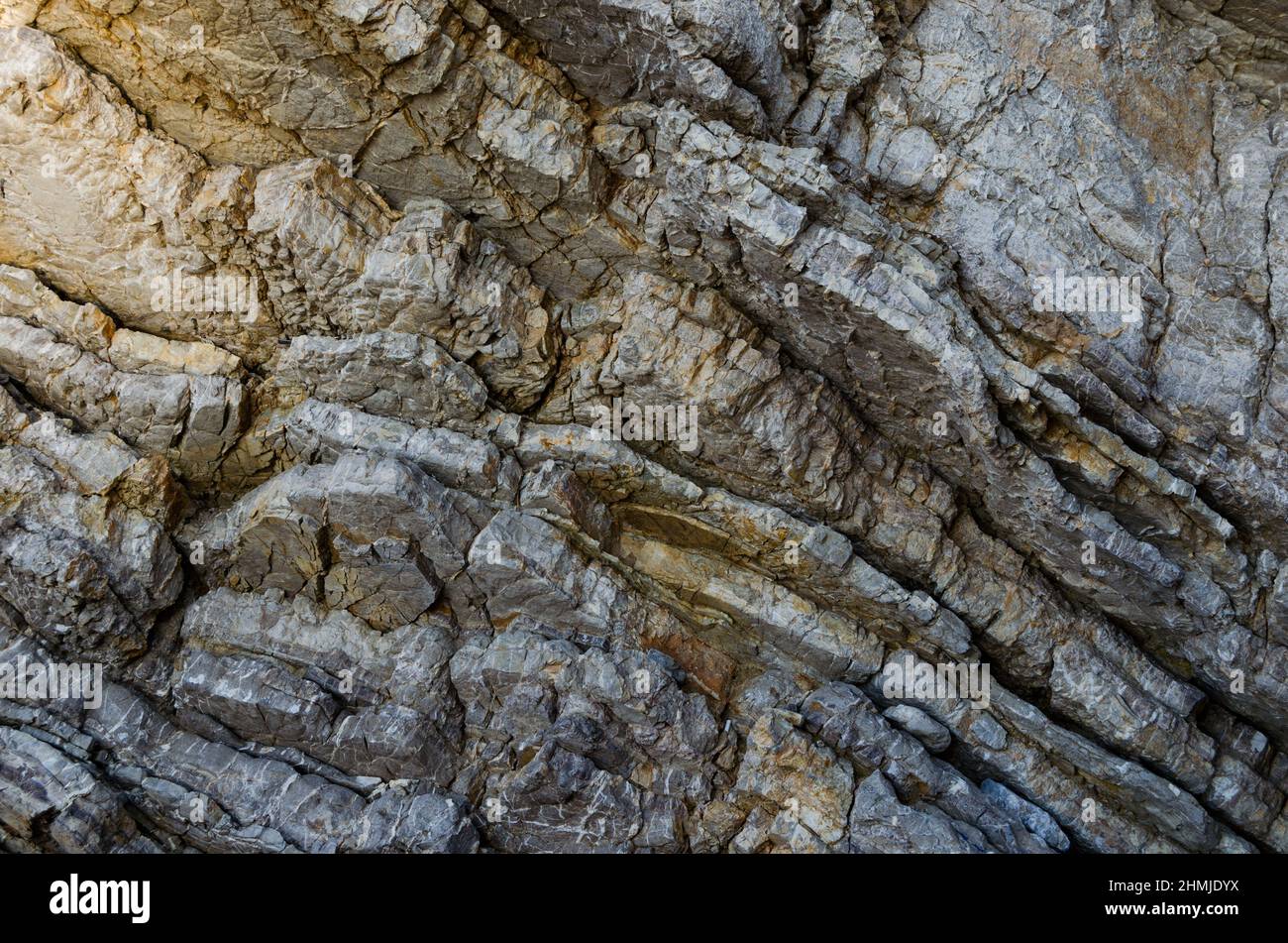 Rock, the background of the layers of ancient sediments.Layered stone ...