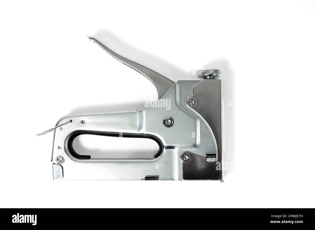 Metal Nickel plated stapler gun on white background, isolate close up. Stock Photo