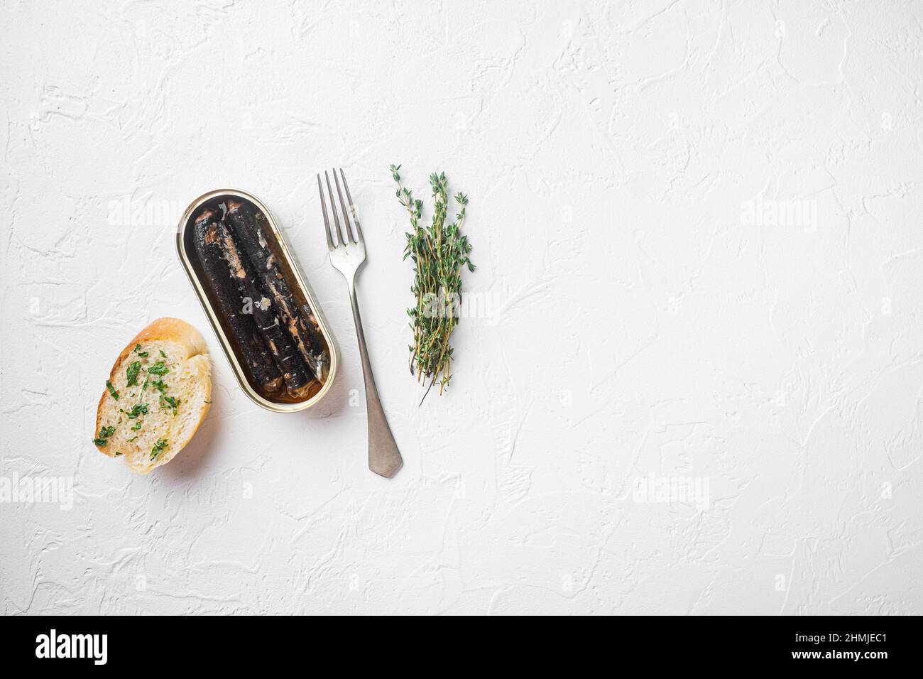 Canned fish in oil set, on white stone table background, top view flat ...