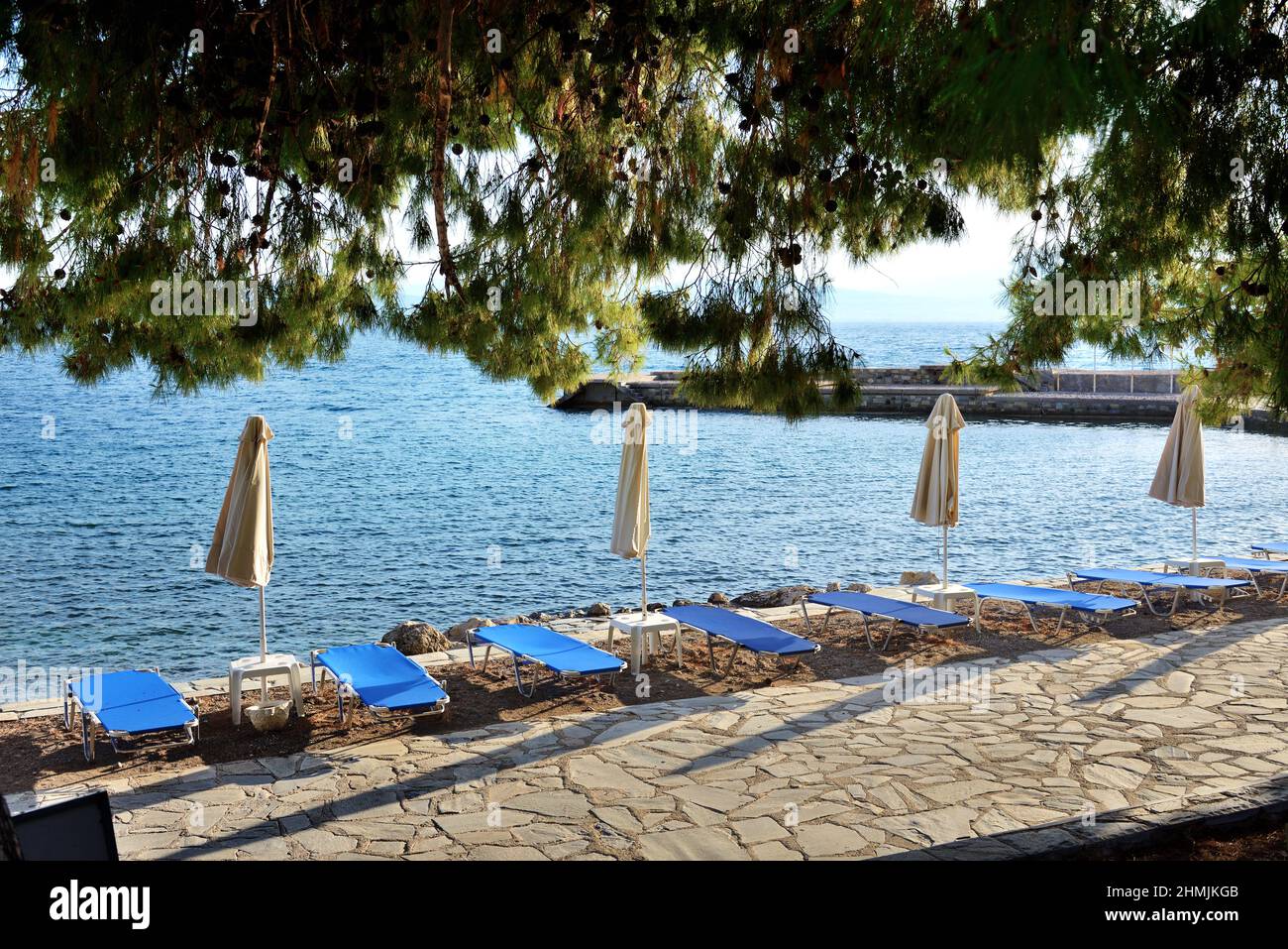 Sunbeds on the beach at luxury hotel, Peloponnes, Greece Stock Photo