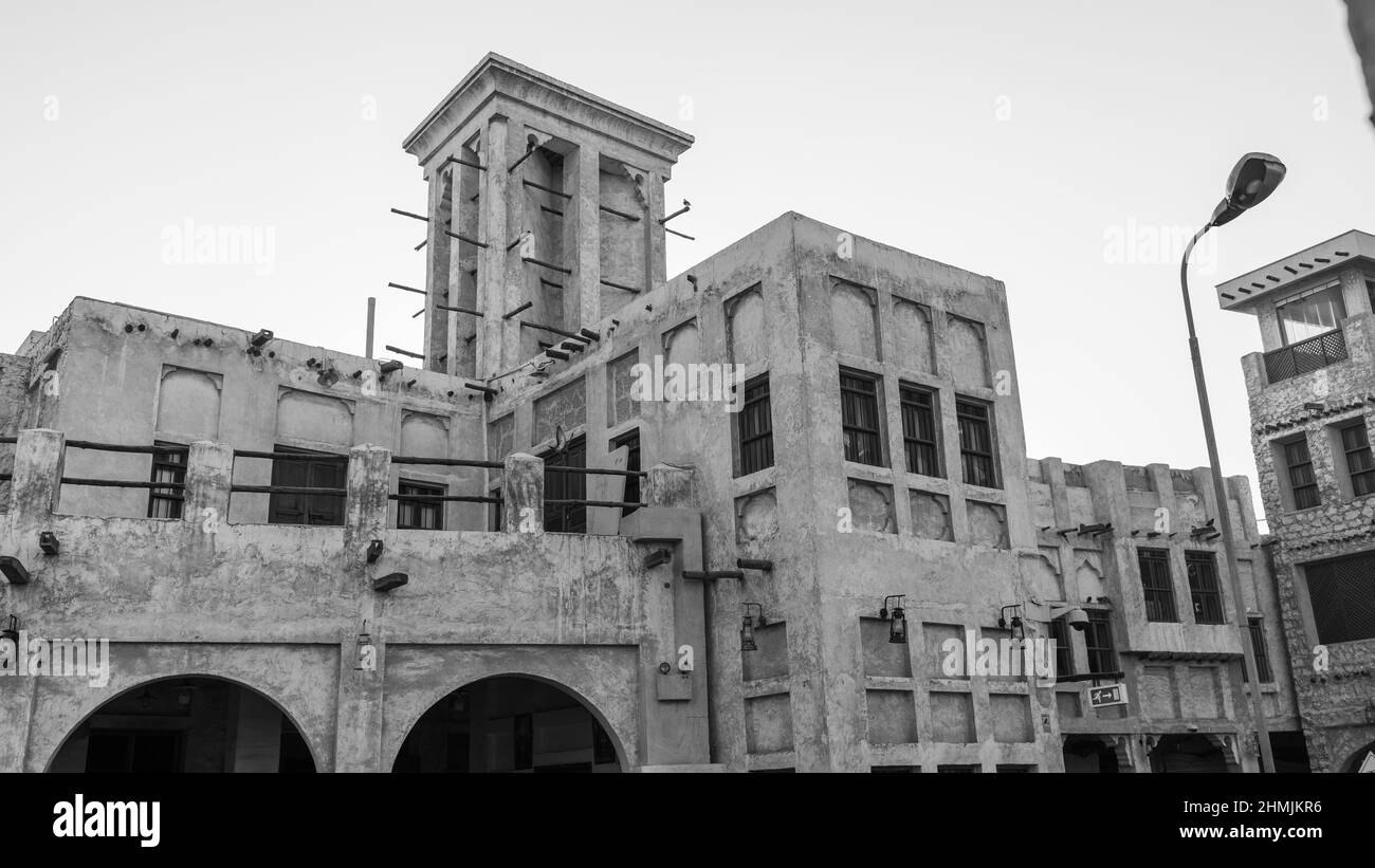 Traditional Arabian building built with wood and mud decorated with a facade in the traditional Arabic style at Souq Waqif (traditional market)of Doha Stock Photo