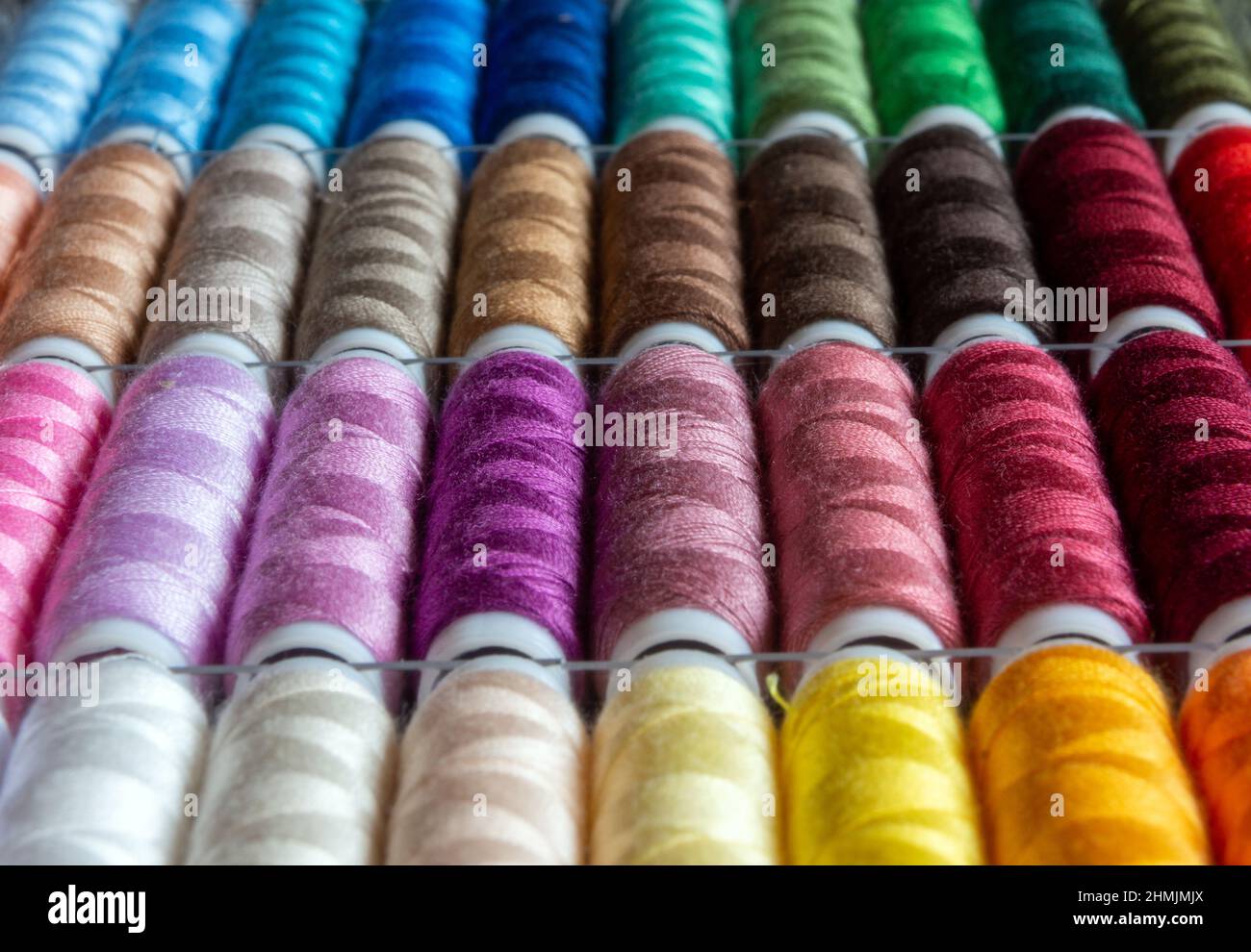 Sewing thread rolls in different colors Stock Photo - Alamy