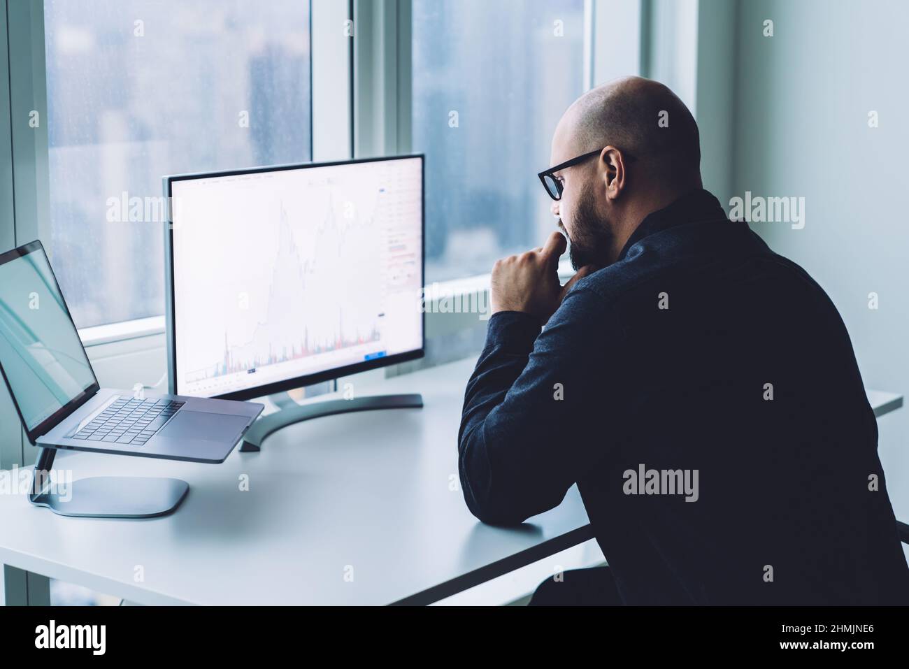 Serious man working on computer in office Stock Photo - Alamy