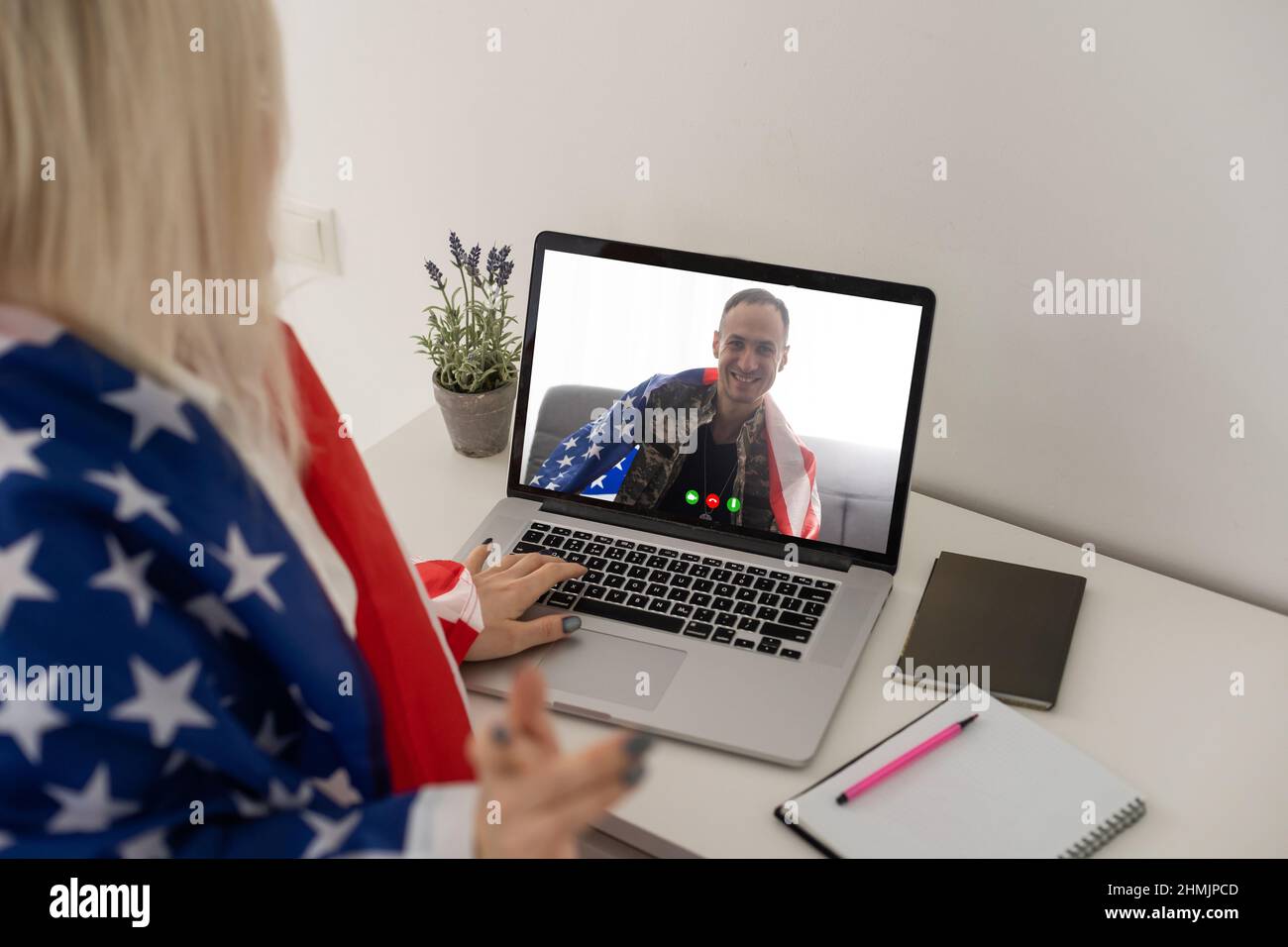 Mature male soldier using laptop in headquarters building for ...