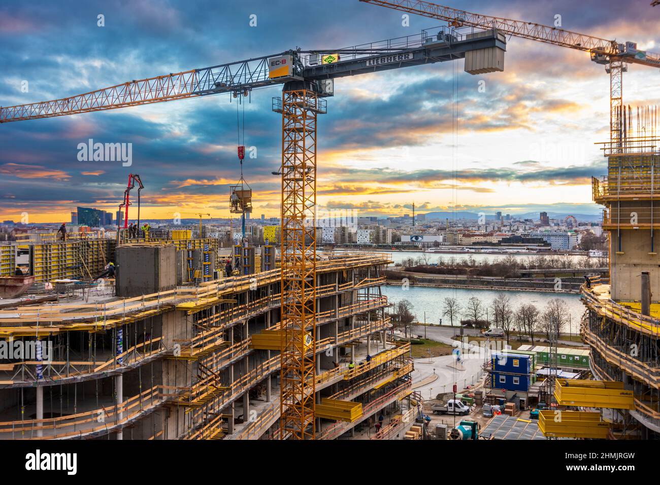 Wien, Vienna fiery sunset at construction site of highrise apartment