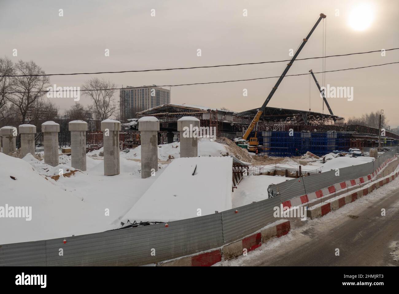 Construction of a bridge in winter in Moscow near the railway station Stock Photo