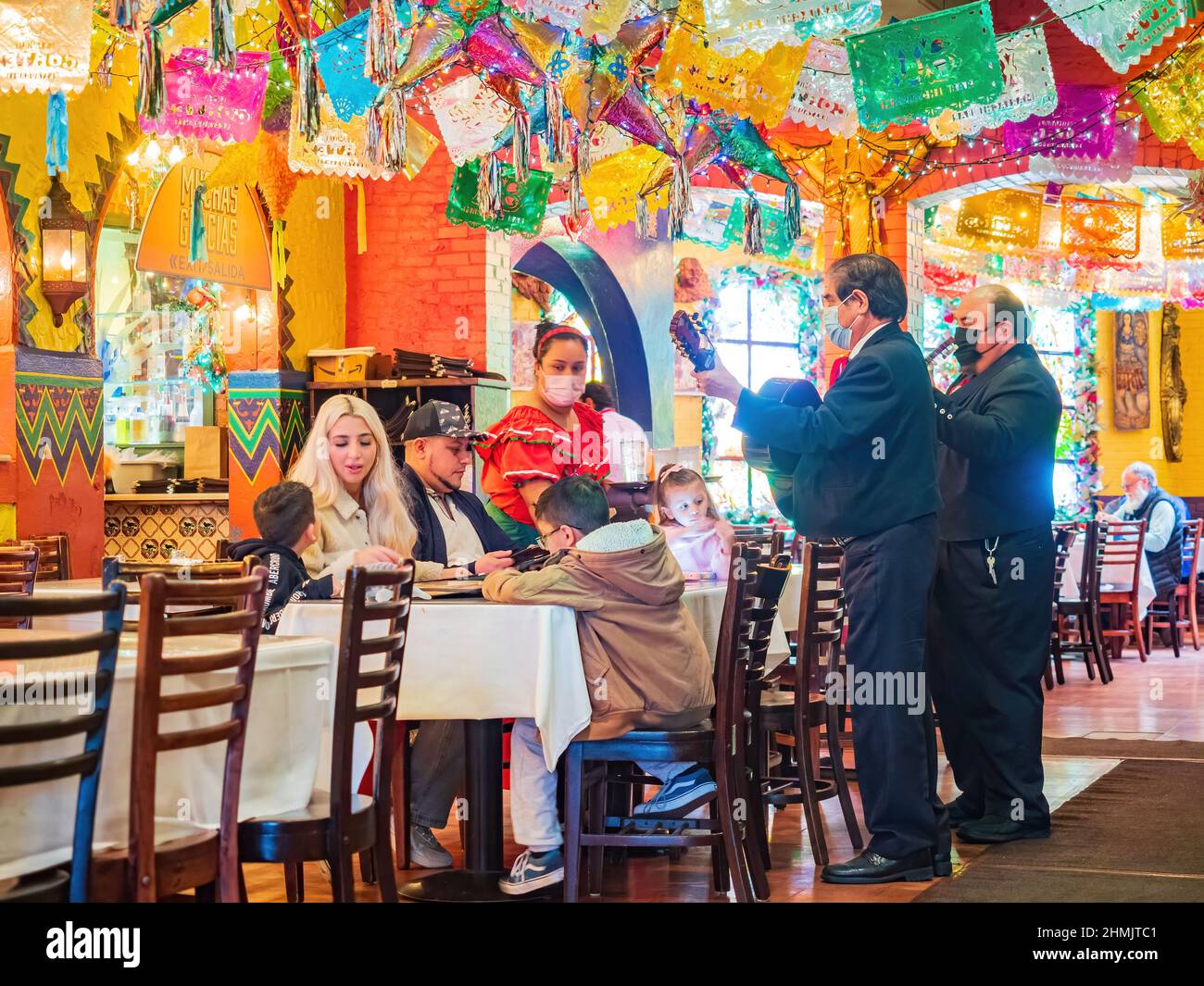 Texas, FEB 2 2022 - People doing musical performance in the El Mercado Snack Bar Stock Photo