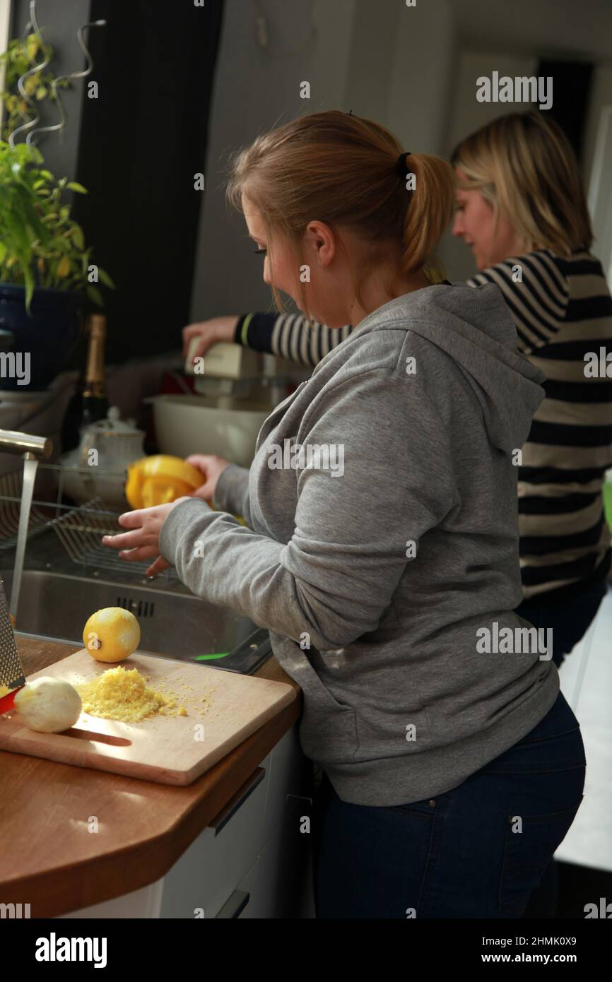 A woman at home making a cake, UK Stock Photo