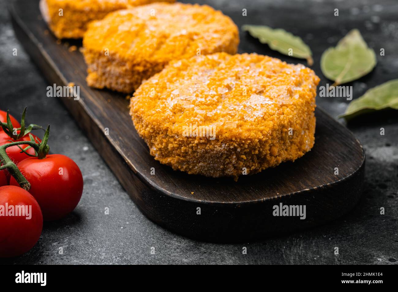 Raw salmon burger patties set, on black dark stone table background ...