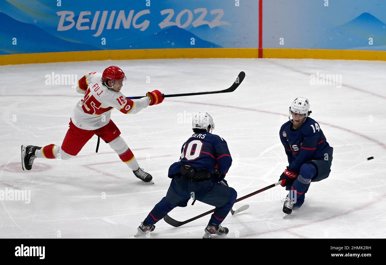 Beijing, China. 10th Feb, 2022. Fu Jiang (L) of China competes during ice hockey men's Group A match between the United States and China at National Indoor Stadium in Beijing, capital of China, Feb. 10, 2022. Credit: Liu Xiao/Xinhua/Alamy Live News Stock Photo