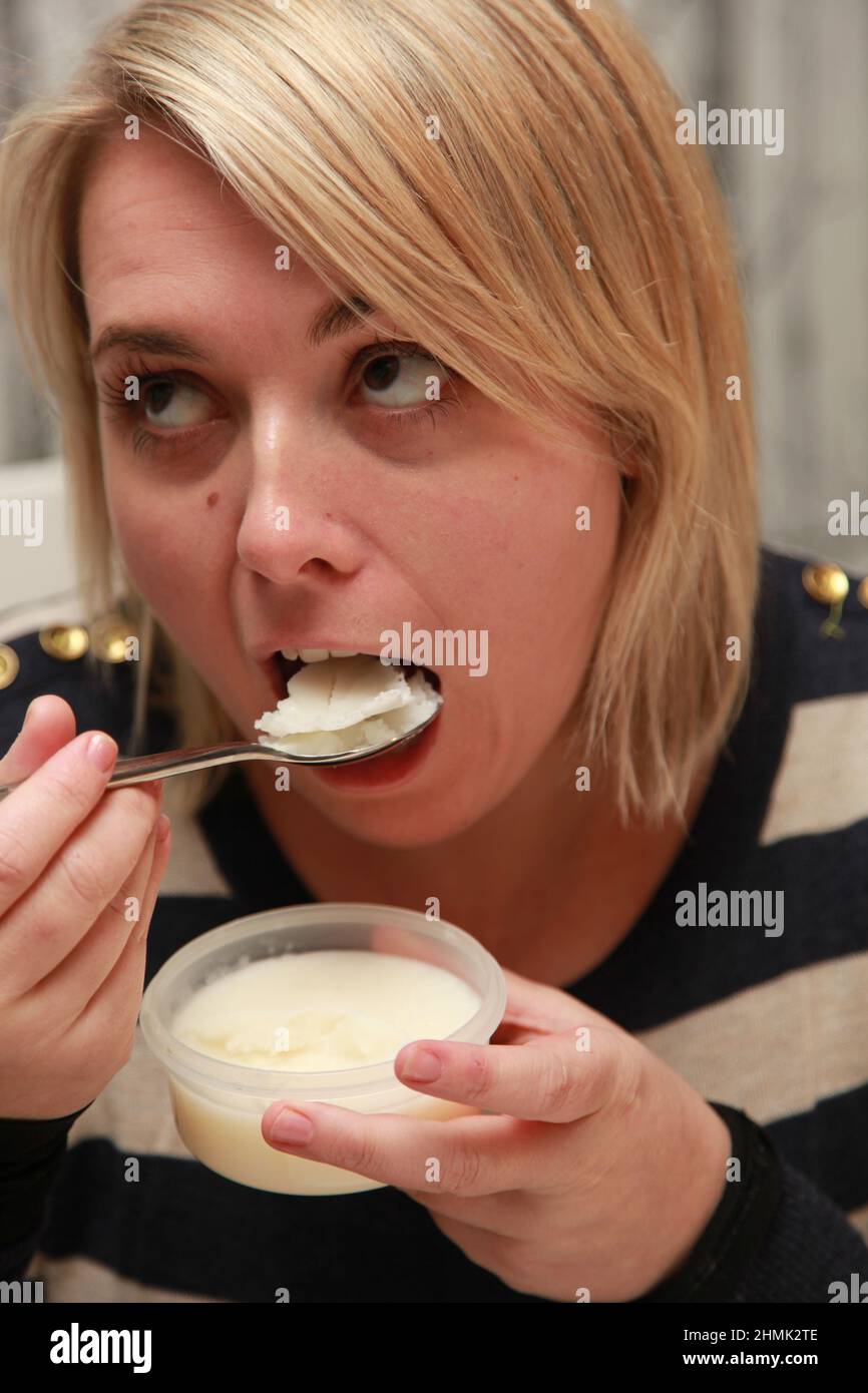 A young female eating. Stock Photo