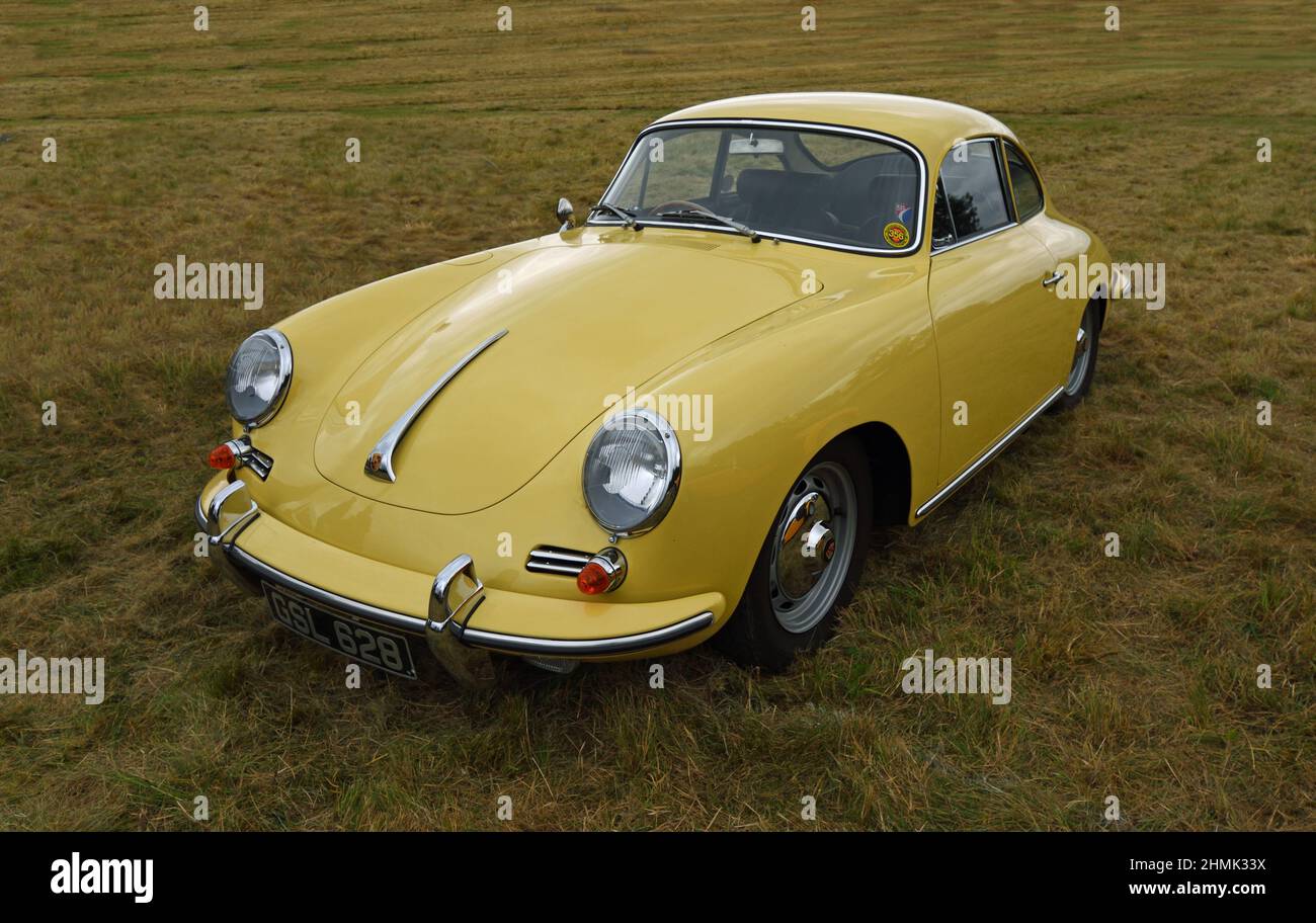 Classic  yellow Porsche 356s  isolated parked on grass. Stock Photo