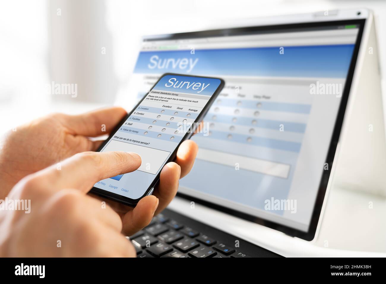 Cropped Image Of Businessman Giving Online Survey On Digital Tablet At Office Desk Stock Photo