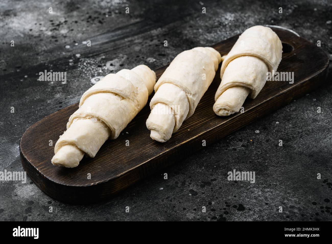 Fresh raw croissants set, on black dark stone table background Stock ...