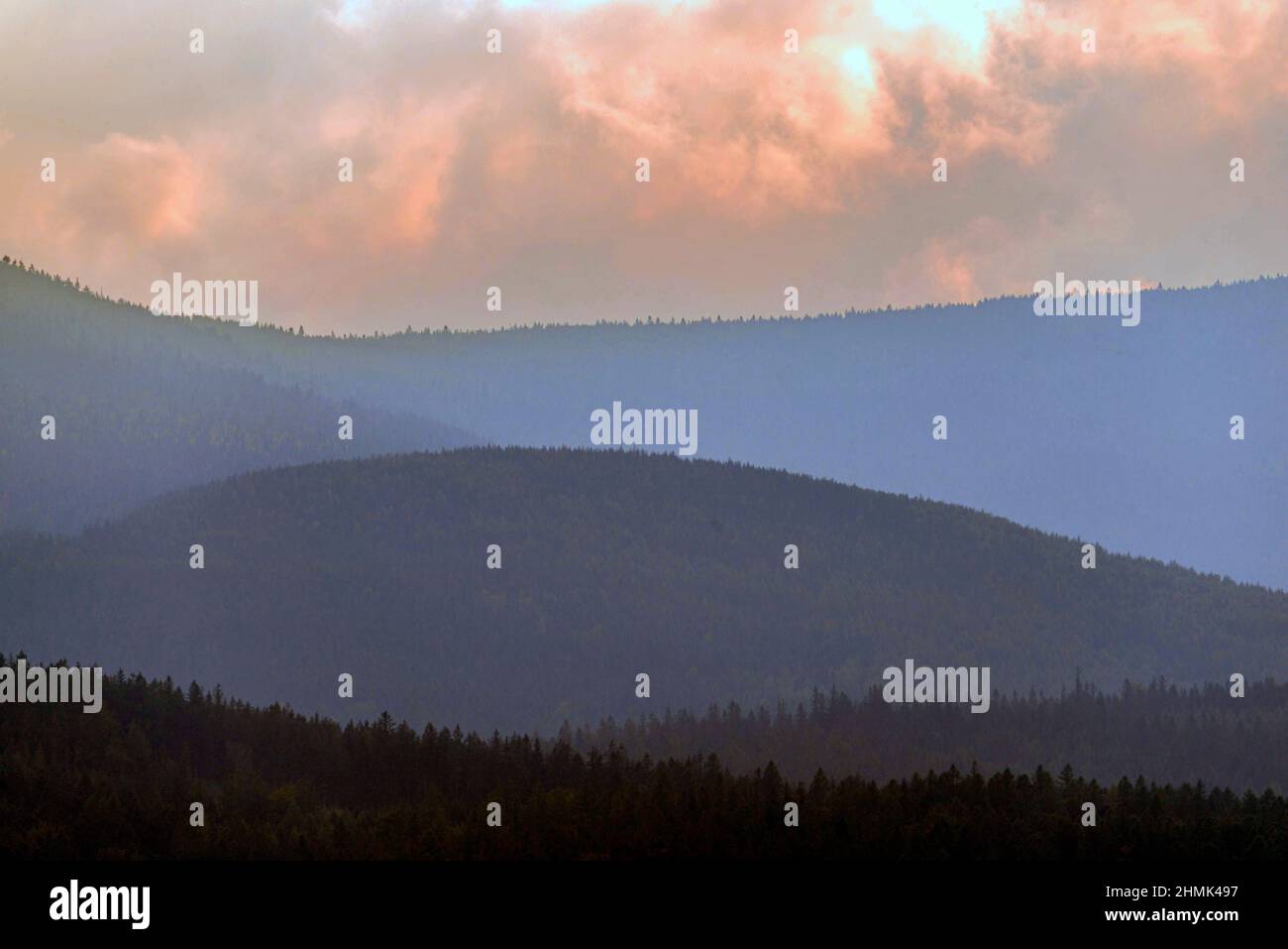 Cloudy sky with mountain forest hi-res stock photography and images - Alamy