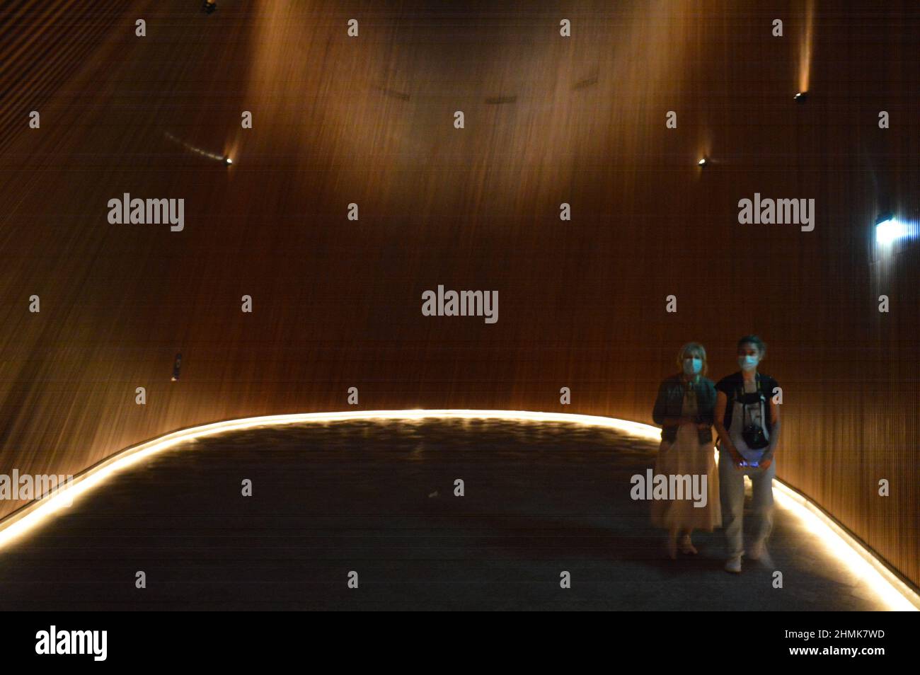 Two women wearing face masks inside The Finnish Pavilion at Expo 2020