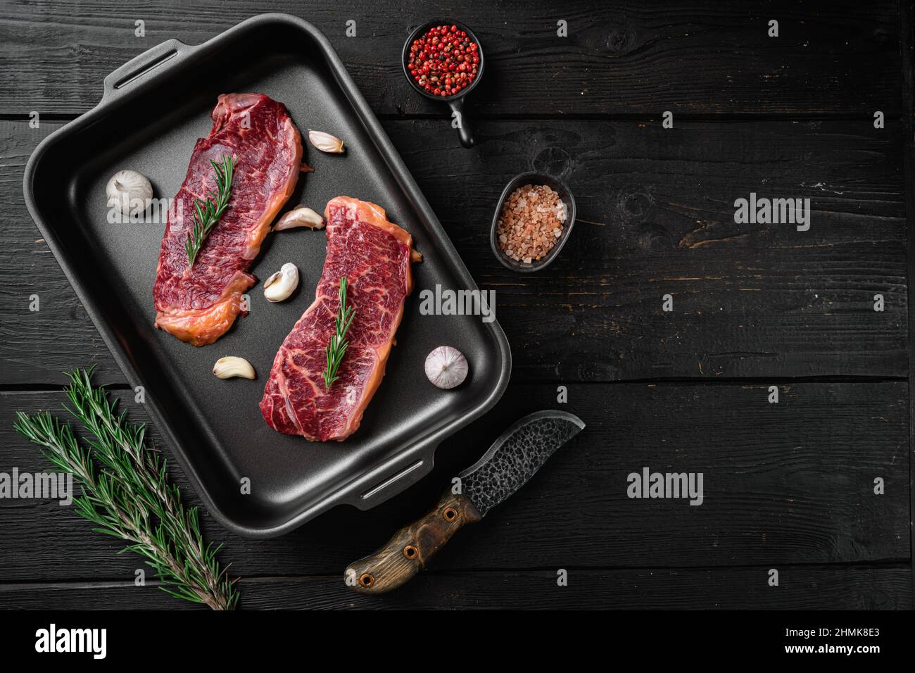 New-York steak set, on black wooden table background, top view flat lay ...