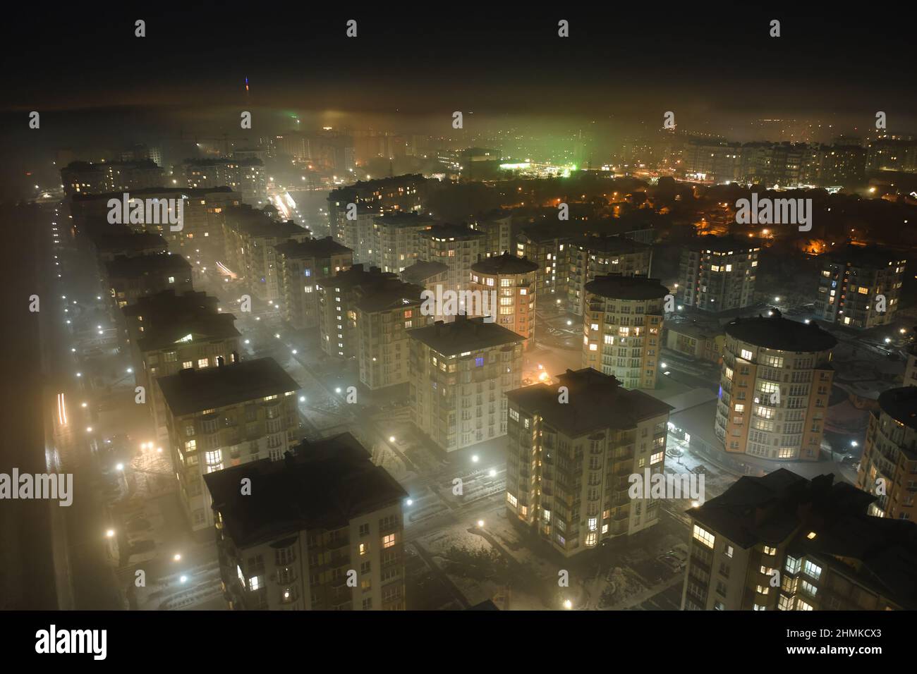 Aerial view of high rise apartment buildings and bright illuminated ...